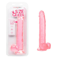 a pink detailed penis shaped dildo with balls and a suction cup, shown next to its plastic packaging