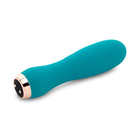 Turquoise handheld massager with rose gold accents on a white background