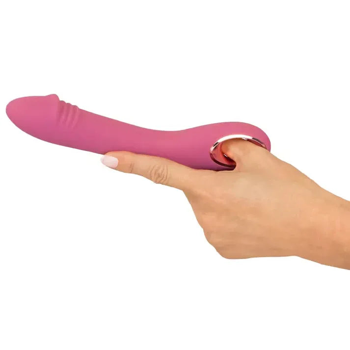 Pink slim g sport rose vibrator held in a hand on a white background