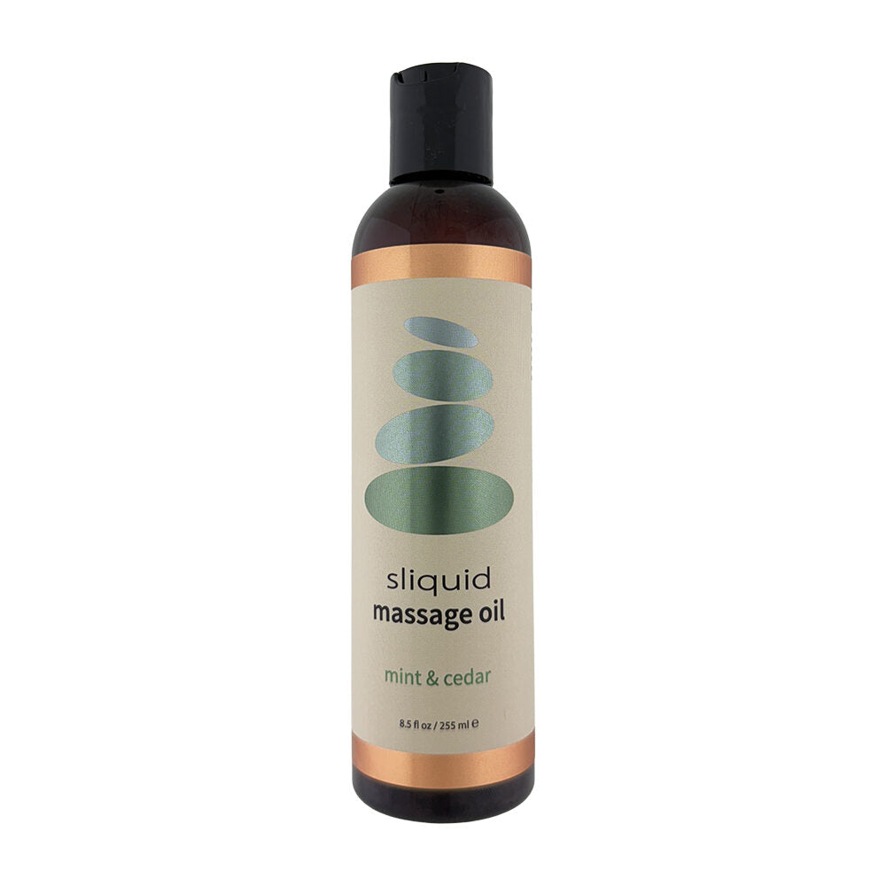 Sliquid massage oil mint & cedar bottle with a white background
