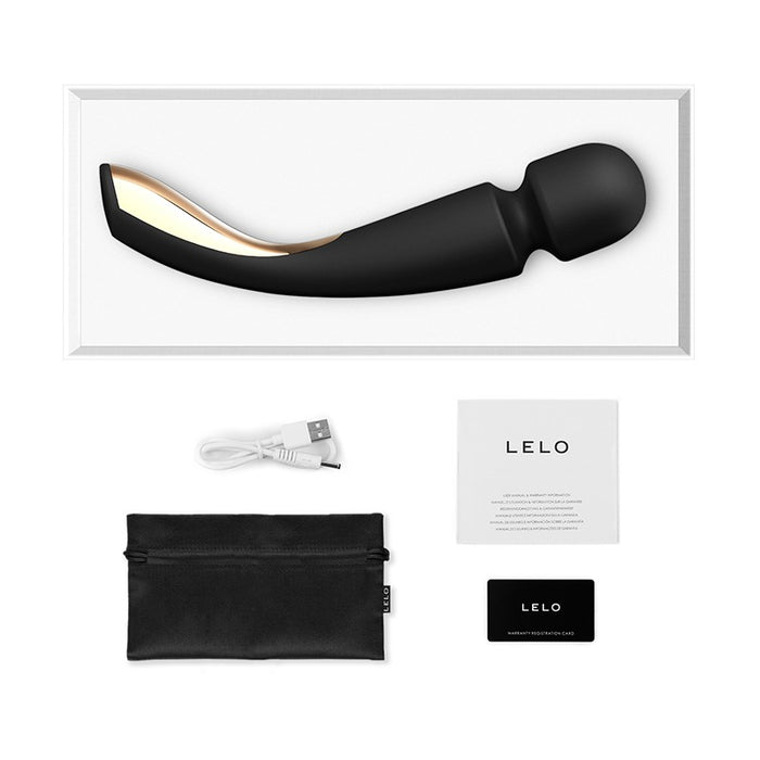 black curved massager with head and gold plating on handle with charger & storage bag