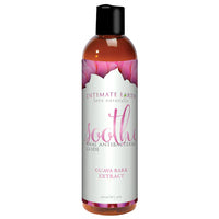 The product comes in an amber bottle with a black cap. It has a cream label with pink petals and has pink and black writing.