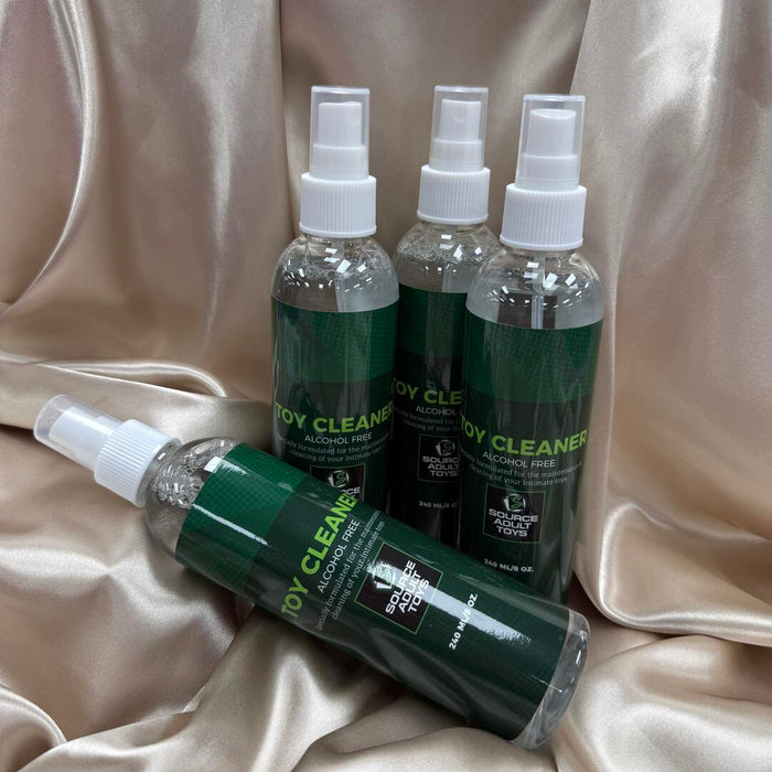 Source Adult Toy cleaner bottles on a satin surface