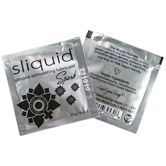 The product comes in a silver foil packet with black writing and black flower designs