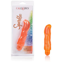 an orange thick vibrator with a slightly curved tip and orange cap next to its plastic packaging
