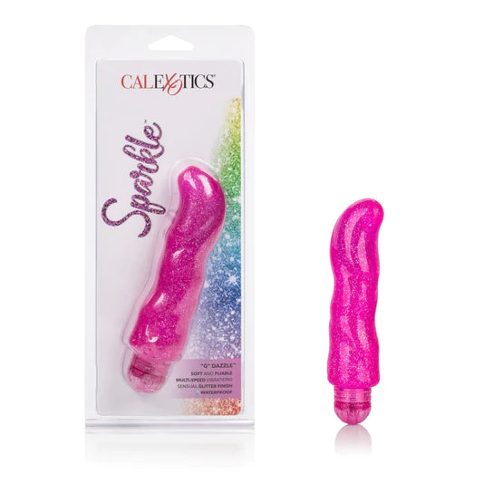 a pink thick vibrator with a slightly curved tip and pink cap next to its plastic packaging