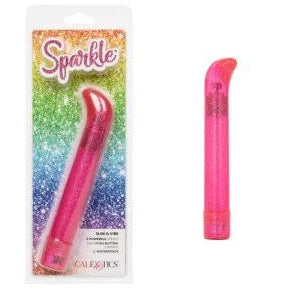 a pink sparkle vibrator with a straight shaft and a short curved pointed tip shown next to its plastic packaging
