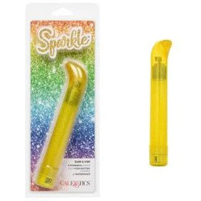 a yellow sparkle vibrator with a straight shaft and a short curved pointed tip shown next to its plastic packaging