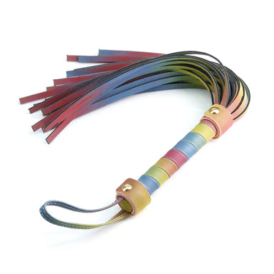a pastel rainbow flogger with a wrist strap