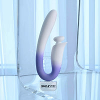 Gradient purple to white vibrator on a reflective surface with 'Evolved' branding.