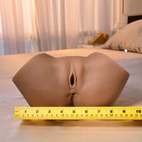 Mannequin torso with a measuring tape on a bed in a bedroom setting