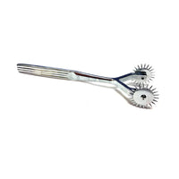 Metal tool with 2 prongs on a white background