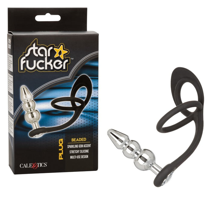 black silicone cockring with ball sling with beaded plug attachment next to star fucker box