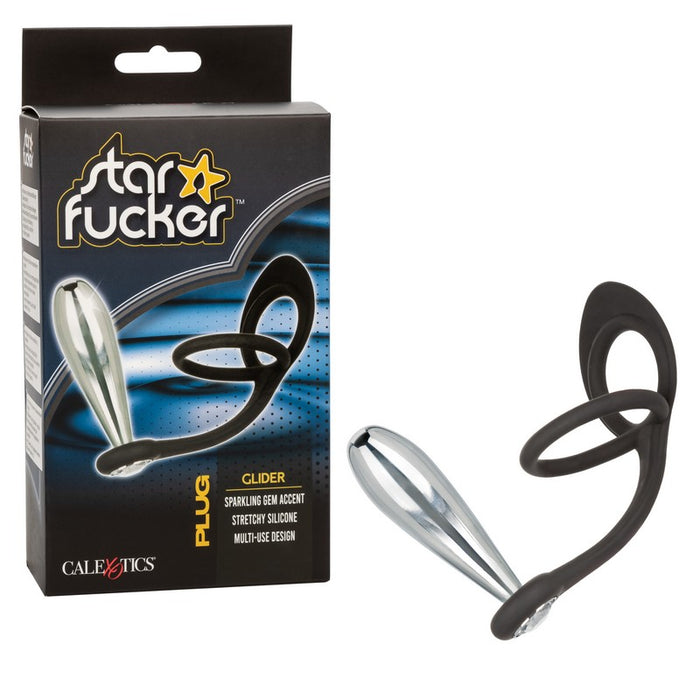 black silicone cockring with ball sling with plug attachment next to star fucker box