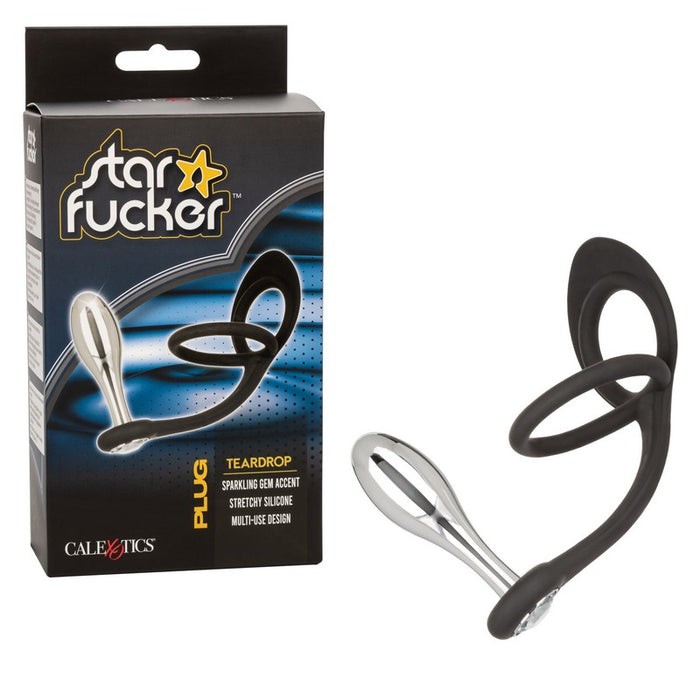 black silicone cockring with ball sling with teardrop plug attachment next to star fucker box