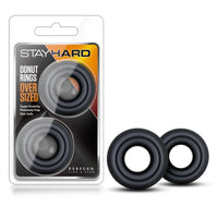 2 pack black donut cock rings next to stay hard package
