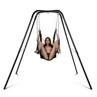 Person using a black swing set on a white background
