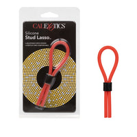 red silicone lasso cock ring next to cal exotics package