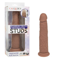 Silicone vibrating & thrusting vibrator with packaging labeled 'Calexotics Studs' on a white background
