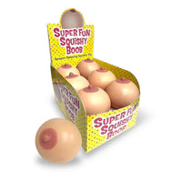 Box of 'Super Fun Squishy Boob' toys with packaging on a white background