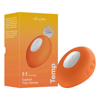 Orange temp toy with 'We-Vibe' branding next to its packaging on a white background