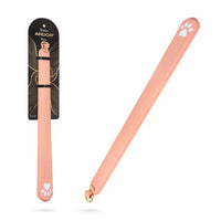 Temptasia Ardor Slapper by Blush silicone impact paddle in blush pink with paw print accents and retail packaging displayed beside the product.