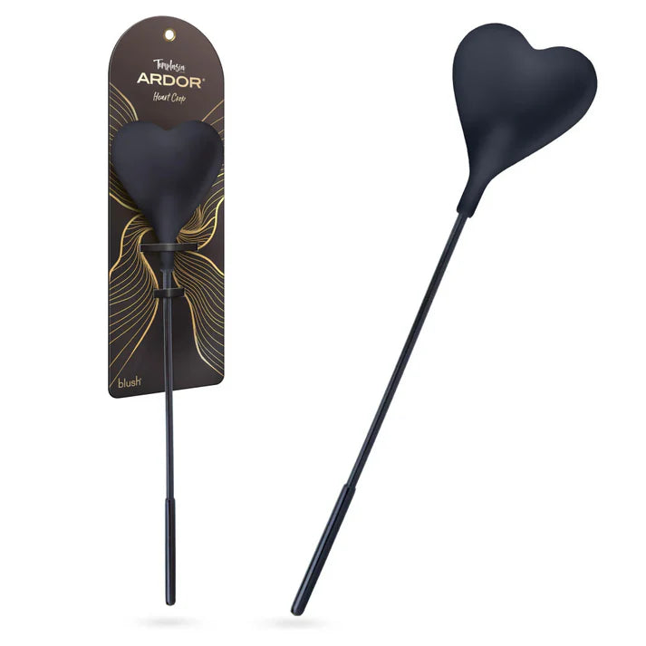 Temptasia Ardor Heart Crop by Blush in black silicone with heart-shaped tip, shown alongside retail packaging and angled product view.