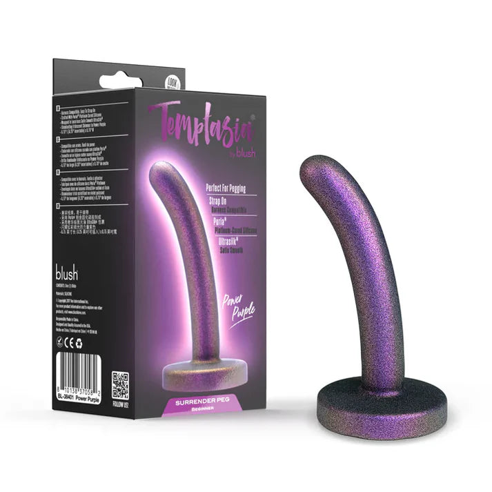 purple curved strap on pegging dildo with bottom base standing beside box