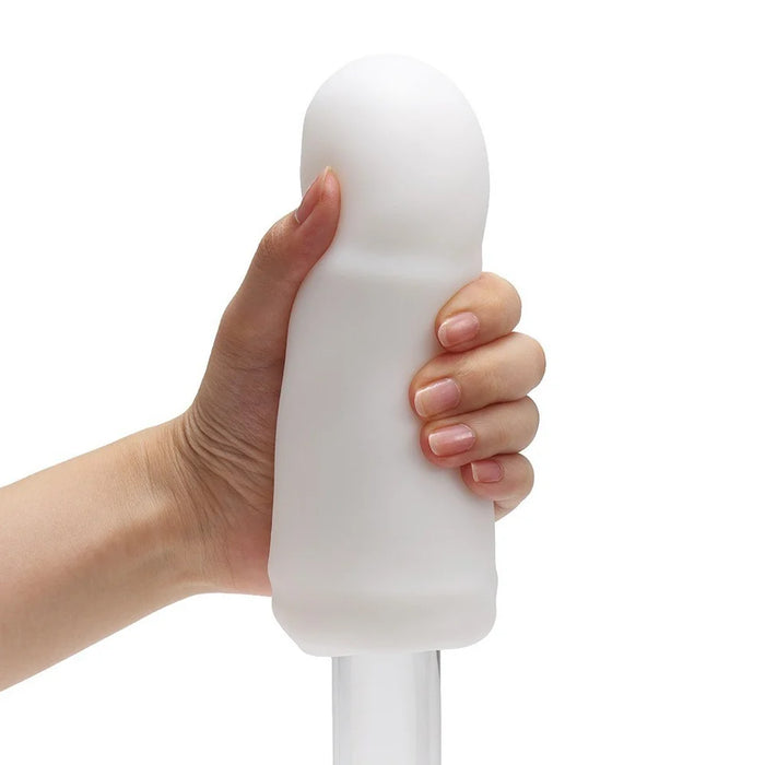 white masturbator, with dildo inside, being held by a hand