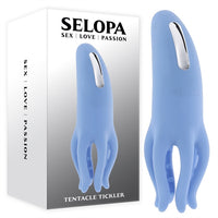 blue vibrator with tentale tickler bottom beside box packaging