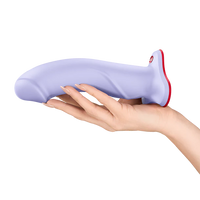 Purple and red the boss stub dildo held in a hand on a white background