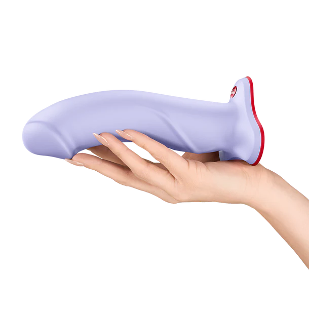 Purple and red the boss stub dildo held in a hand on a white background