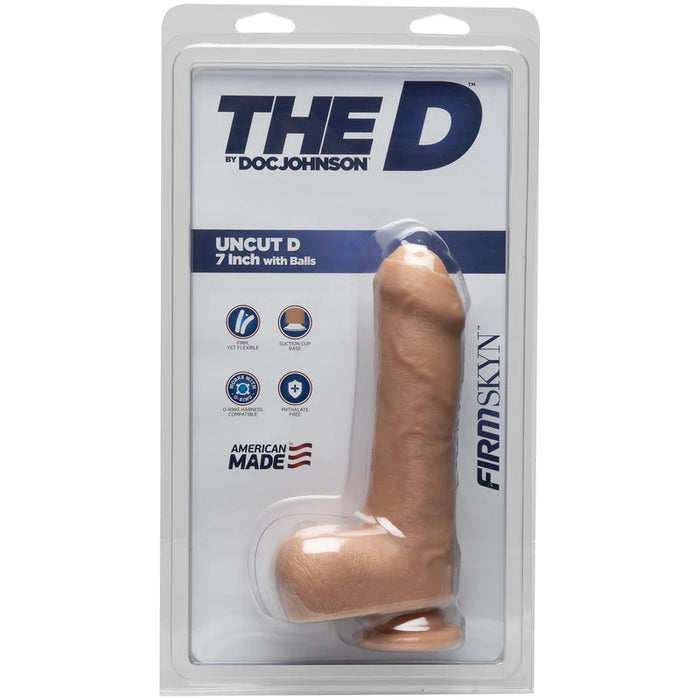 a beige detailed penis shaped dildo with an uncircumcised shaft,  balls and a suction cup, shown in its plastic packaging