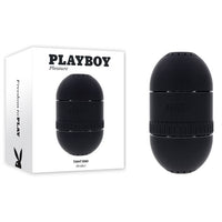 black hard case masturbator beside display box