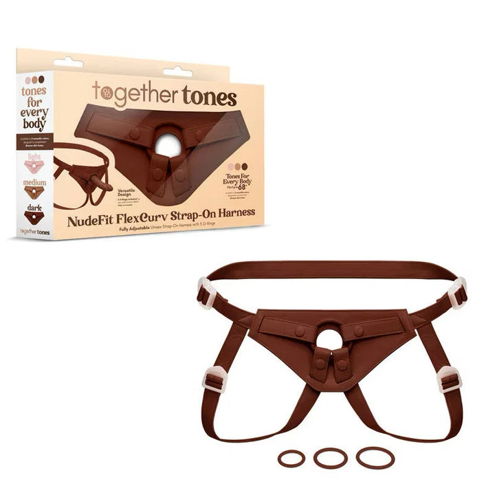 Together Tones NudeFit Strap-On Harness in dark tone with adjustable straps and three interchangeable O-rings, shown with packaging.