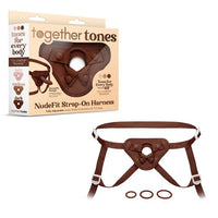 Together Tones NudeFit Strap-On Harness in dark tone with adjustable straps and three interchangeable O-rings, shown with packaging.
