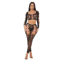 Woman wearing a black fishnet outfit with cut-out design on a white background