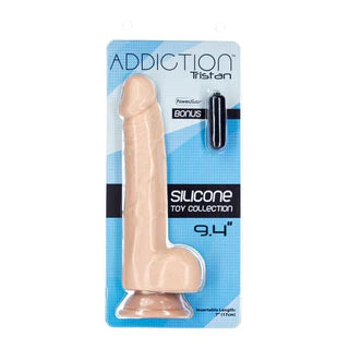 a beige detailed penis shaped dildo with balls and a suction cup, shown in its plastic packaging with a black small vibrator
