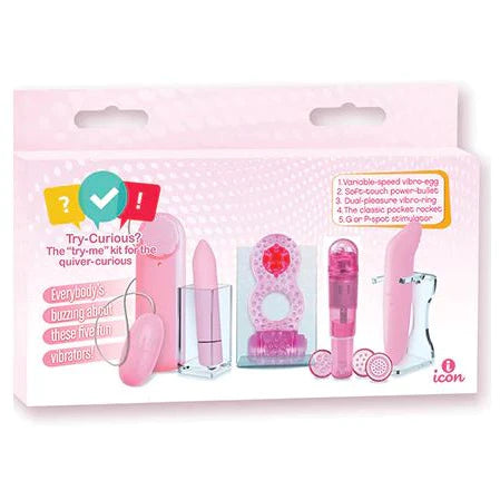 a pink box depicting 5 pink toys included in the kit. A bullet with an attached remote, a pointed tip vibrator, a figure 8 vibrating cockring, a clitoral five with 4 head attachments and a curved tip vibrator