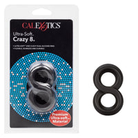 black silicone cock ring and scrotum ring in shape of an 8 next to cal exotics package