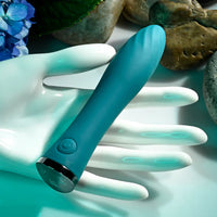 Turquoise vibrator with white gloves on a light blue background