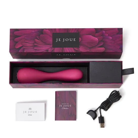 a purple flowered display box opened to reveal a pink g spot vibrator that is thinner at the center. Shown with its black charging cable and instruction booklets