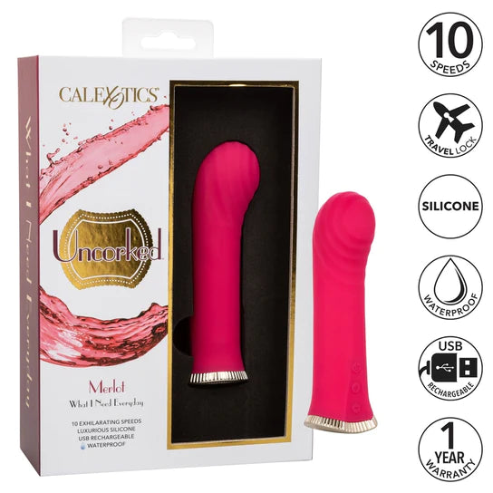 a pink short g spot vibe with ridges at the curved tip and a silver base, shown next to its white display box