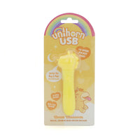 yellow vibrating bullet with unicorn head, bumpy main, and tongue sticking out in plastic packaging