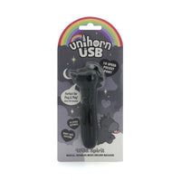black vibrating bullet with unicorn head with spiky main and tongue sticking out in plastic packaging