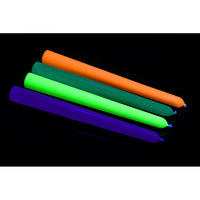 orange, green, yellow and blue black light uv drip candles