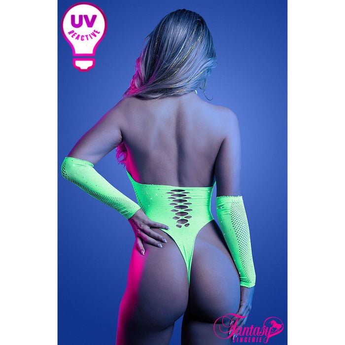 Model wearing a neon green UV reactive teddy against a blue background