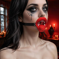 female vampire wearing vibrating vampire mouth gag 