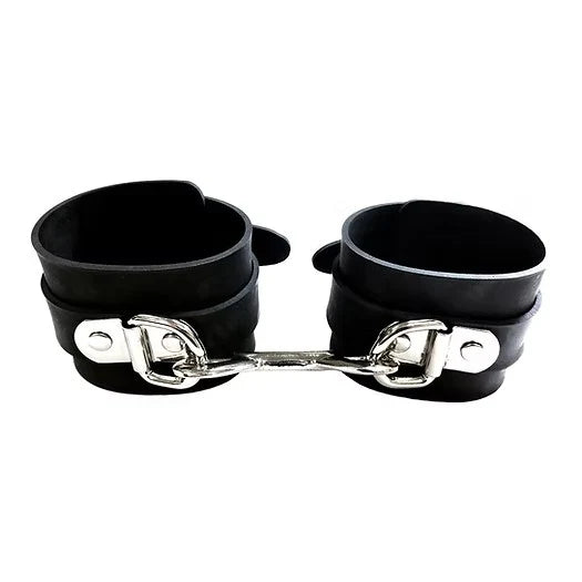 Black leather handcuffs with a silver chain on a white background