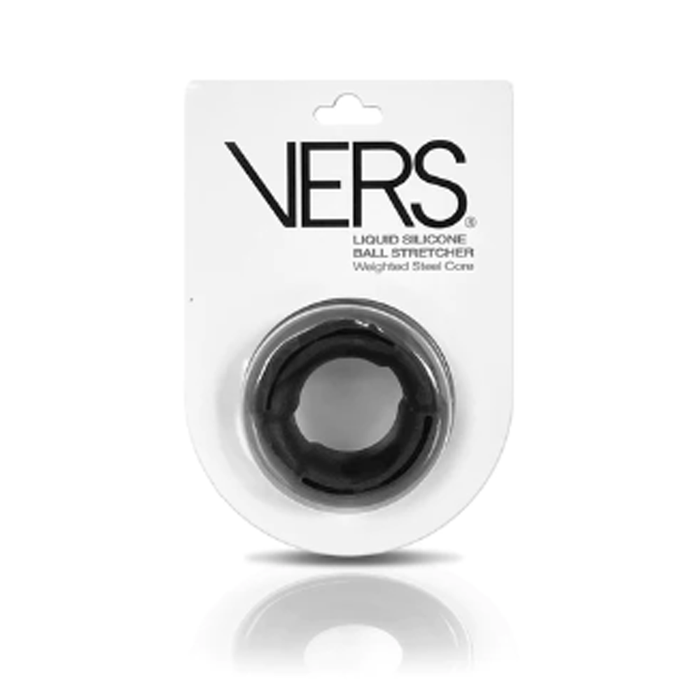 A black liquid silicone ball stretcher by VERS, packaged in a white blister card with black text, shown on a white background with a soft reflection below.